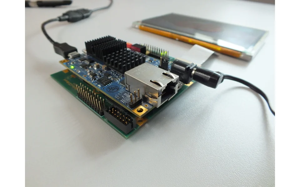 The assembled Antmicro LCD baseboard connected to a Parallella computer, display and power cables.